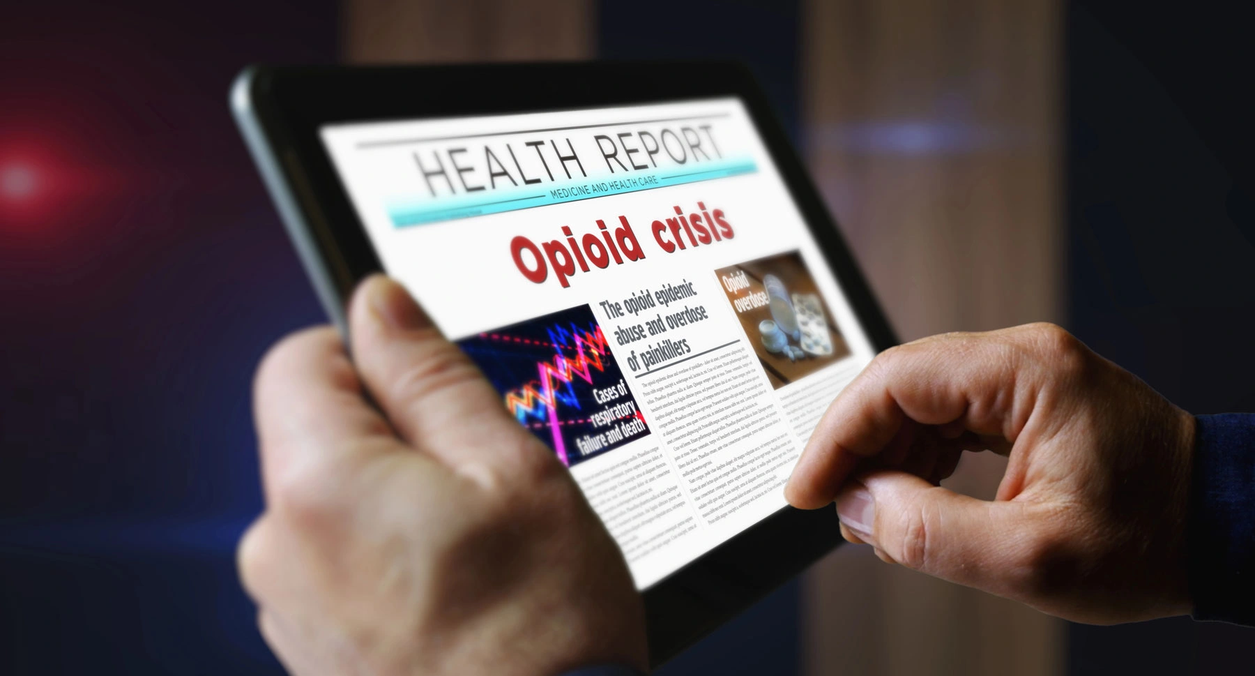 Osoba czyta na tablecie raport o kryzysie opioidowym i przypadkach przedawkowania.